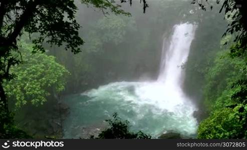 Rio Celeste (Blue River) waterfall in Tenorio Volcano National Park, Costa Rica, Central America. Nature, wilderness, natural landscape, environment protection, jungle, forest, rainforest, trees