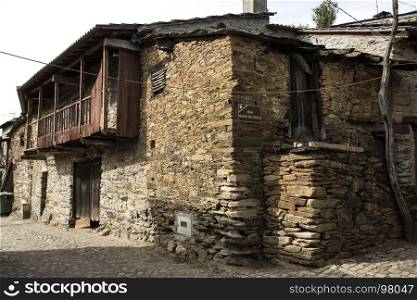 Rio de Onor is a village in northern Portugal with traditional houses on two levels being the upper level for the family and the lower level for animals, cereals and other products of the land