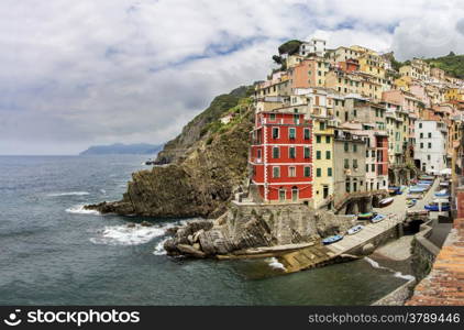 Riomaggiore fisherman village, is one of five famous colorful villages of Cinque Terre in Italy.