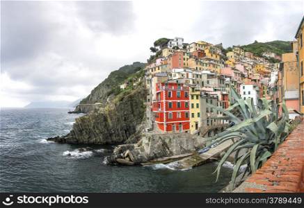Riomaggiore fisherman village, is one of five famous colorful villages of Cinque Terre in Italy.