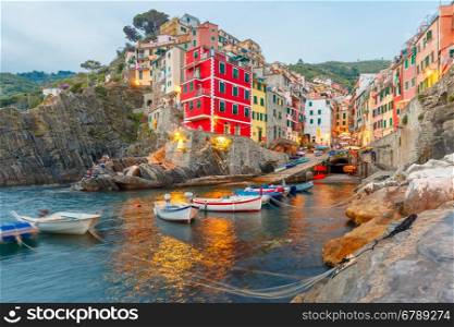 Riomaggiore fishing village in the evening, seascape in Five lands, Cinque Terre National Park, Liguria, Italy.