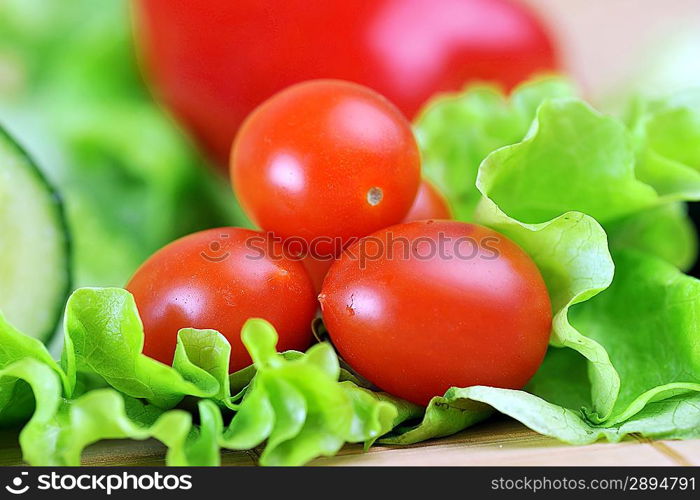 ripe and juicy cherry tomatoes and lettuce