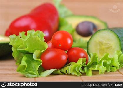 ripe and juicy cherry tomatoes, avocado and lettuce