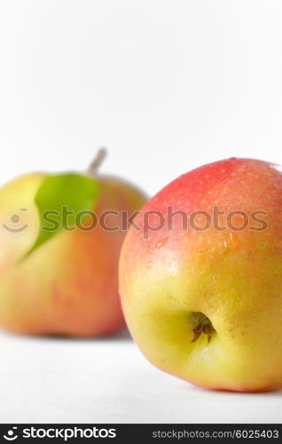 Ripe apples fruit with leaves and water drops