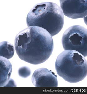 Ripe blueberries levitate on a white background.. Ripe blueberries levitate on a white background