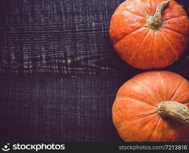 Ripe, bright pumpkin lying on a wooden surface. Place for your inscription. Top view, close-up. Congratulations to loved ones, family, relatives, friends and colleagues. Ripe pumpkin lying on a wooden surface