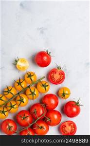 Ripe cherry tomatoes assortment on rustic table top view