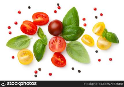 Ripe cherry tomatoes composition with basil and peppercorns isolated on white background. Top view