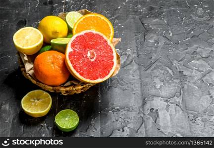 Ripe citrus in the basket. On rustic background. Ripe citrus in the basket.
