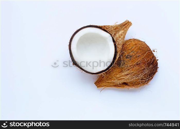 Ripe coconut on white background. Top view of tropical fruit.