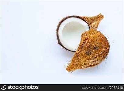 Ripe coconut on white background. Top view of tropical fruit. Copy space