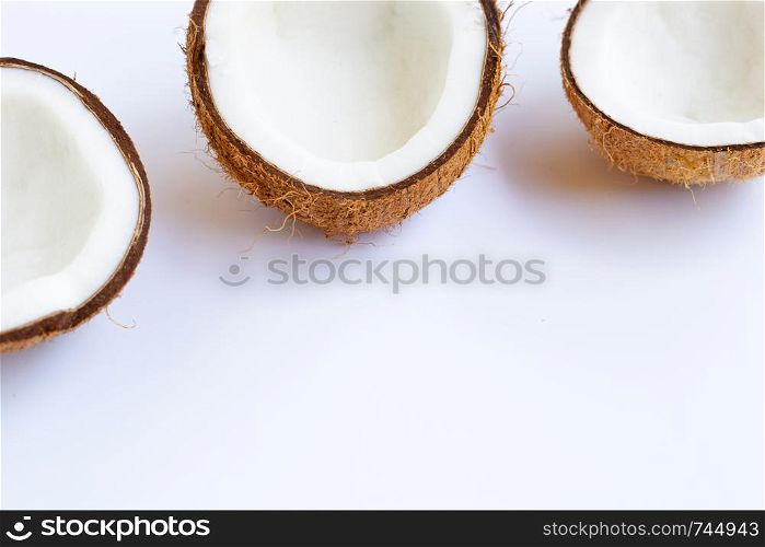 Ripe coconuts on white background. Copy space with tropical fruit.