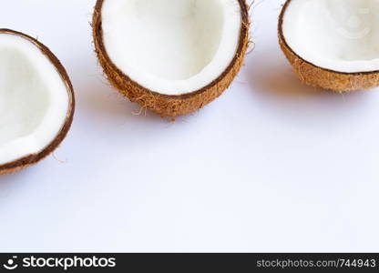 Ripe coconuts on white background. Copy space with tropical fruit.