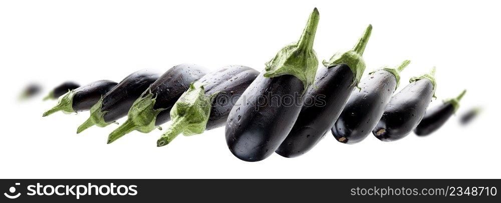 Ripe eggplants levitate on a white background.. Ripe eggplants levitate on a white background