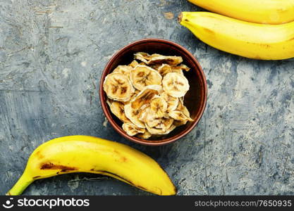 Ripe fresh and dried banana in a bowl. Dried banana slices