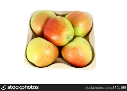 Ripe fresh apple in a karton container, isolated