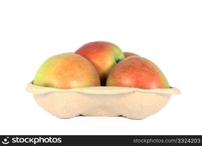 Ripe fresh apple in a karton container, isolated