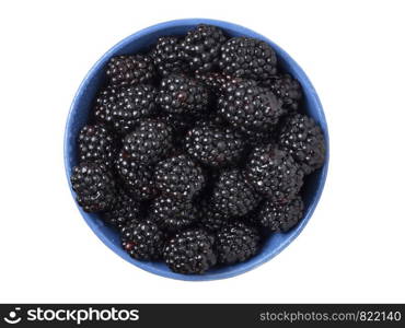 Ripe fresh blackberries in a bowl on white background. Top view.