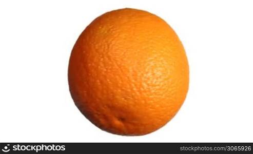 ripe fresh orange rotates fast then stops, close-up, white background with alpha channel