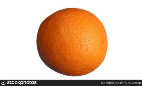 ripe fresh orange rotating along horizontal axis, close-up, white background with alpha channel