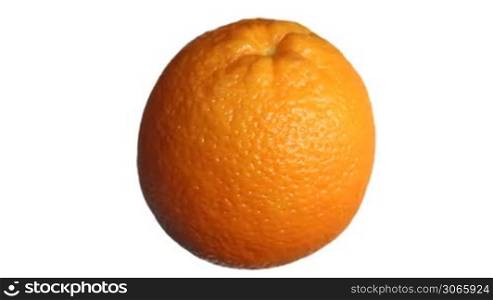 ripe fresh orange rotating then stops, close-up, white background with alpha channel