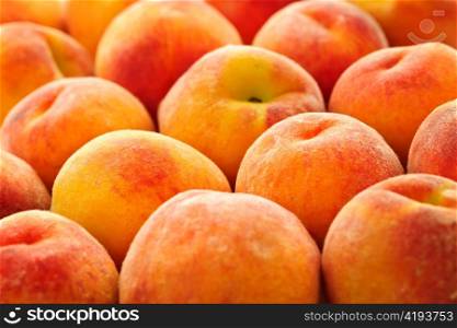 Ripe fresh peaches as background close up