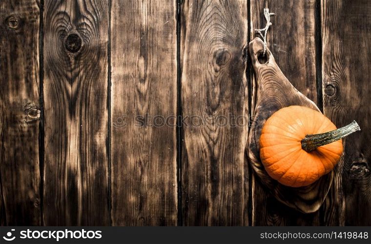 Ripe fresh pumpkin. On a wooden table. Ripe pumpkin.