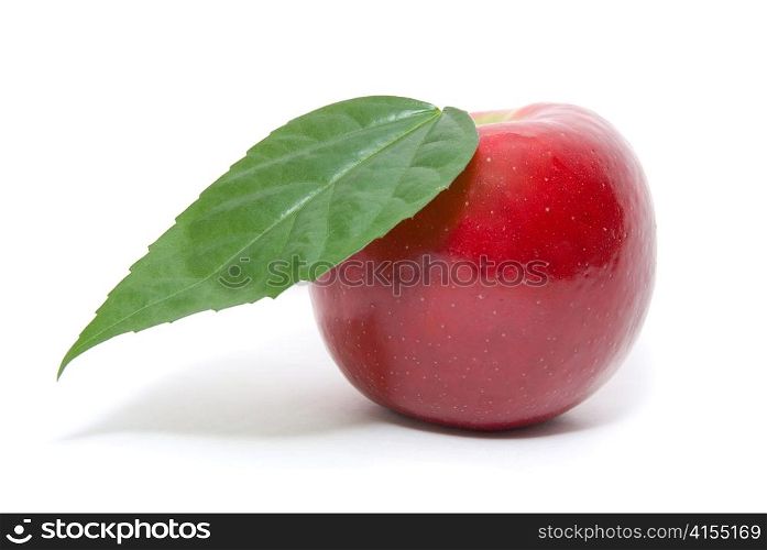 ripe fresh red apple with leaf isolated on white