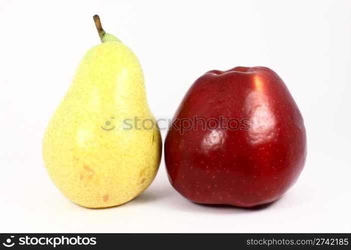 Ripe fresh yellow pear and red apple