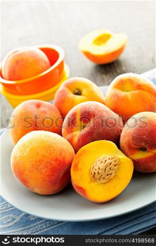 Ripe juicy peaches on a plate ready to eat
