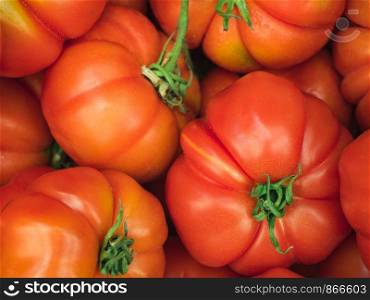 Ripe, juicy red tomatoes. Top view, close-up. Harvest concept. Ripe, juicy red tomatoes. Top view. Harvest concept