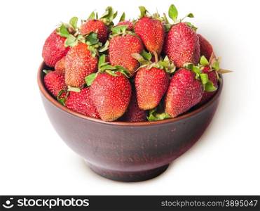 Ripe juicy strawberries in a ceramic bowl top view isolated on white background