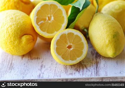 ripe lemons fruits on wooden table