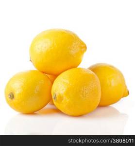 ripe lemons on a white background