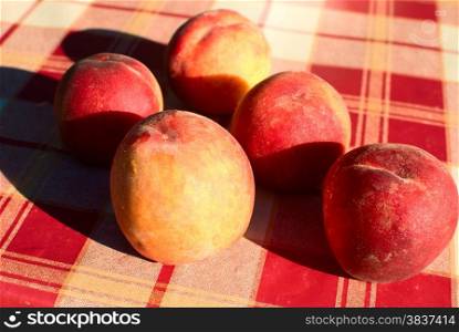 Ripe peaches laying on the table