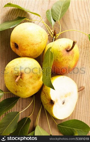Ripe pears closeup on wooden table