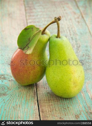 ripe pears on old wooden table