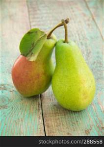 ripe pears on old wooden table