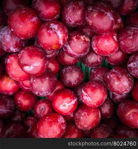 Ripe Plums Background. Fresh ripe red plums