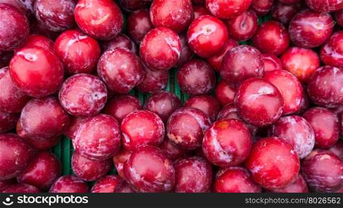 Ripe Plums Background. Fresh ripe red plums