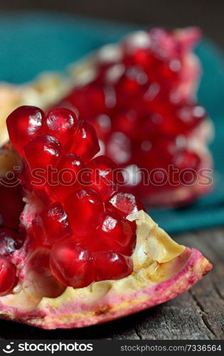 Ripe pomegranate fruit on wooden table