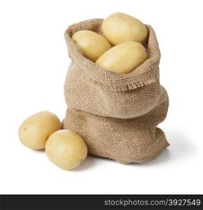 Ripe potatoes in burlap sack isolated on white background. with clipping path