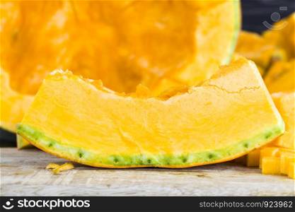 ripe pumpkin on the kitchen table indoors, from which they will prepare dietary meals and food. ripe pumpkin on the kitchen