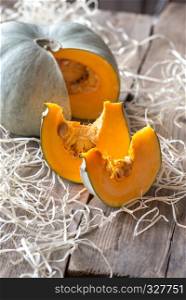 Ripe pumpkin on the wooden background