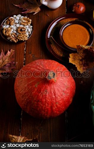 ripe pumpkin served at wooden rural brown table. cooking recipe. healthy life concept