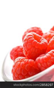 Ripe raspberries isolated on white background