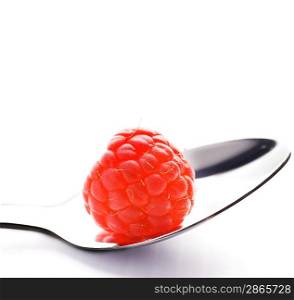 Ripe raspberry in silver spoon isolated on white background