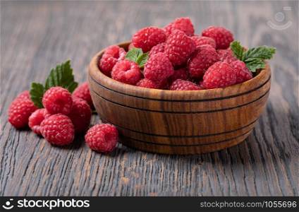 ripe raspberry isolated on a wooden table. ripe raspberry