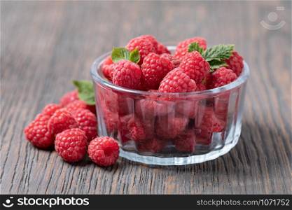 ripe raspberry isolated on a wooden table. ripe raspberry