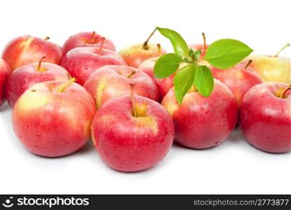Ripe red apples with a leaf